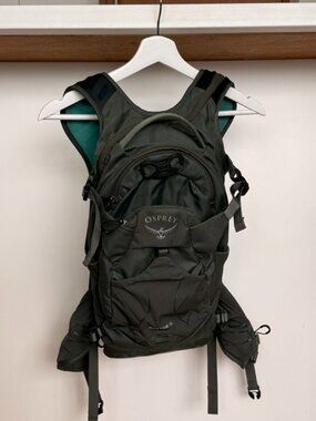 Raptor 14 hydration pack in a dark green color | Osprey